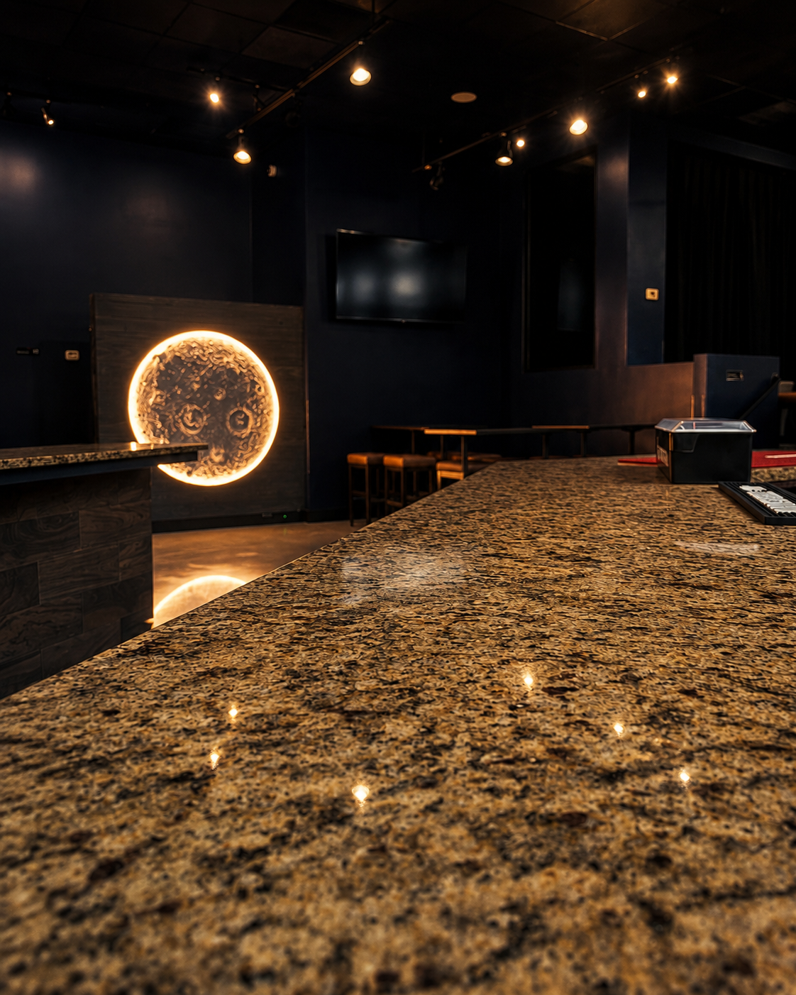 House cocktail and bottle on the bar